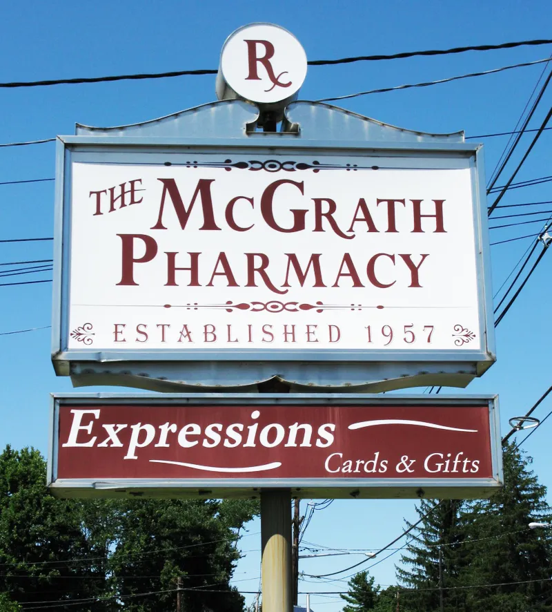 pharmacist greeting a patient inside The McGrath Pharmacy